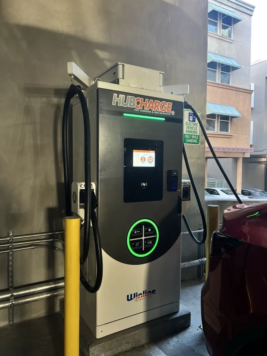 A HubCharge charging bay at Alhambra with a car parked alongside