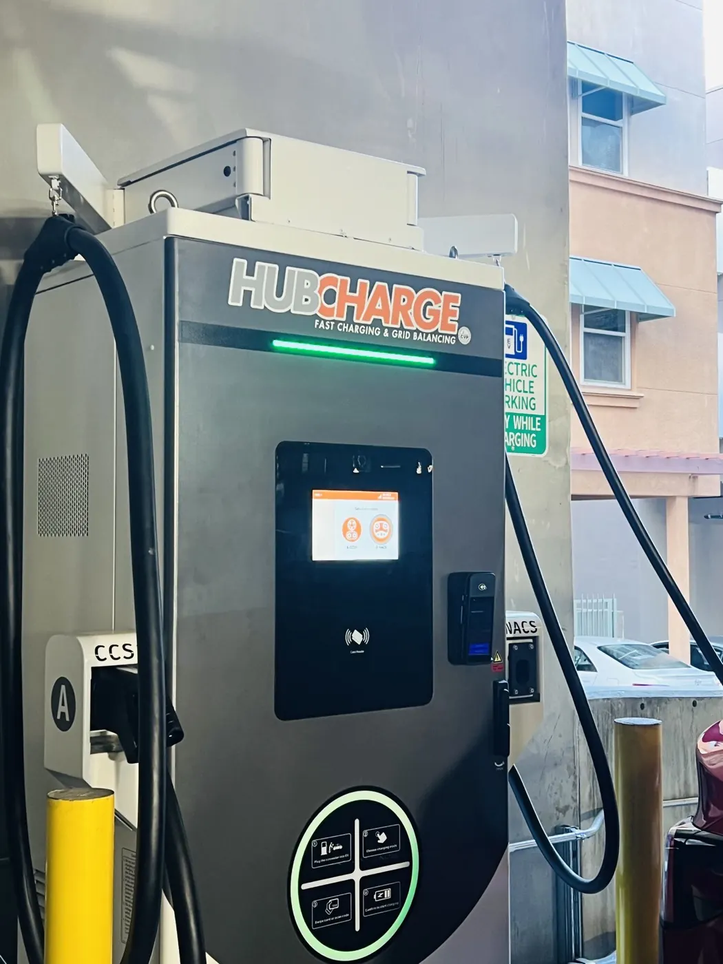 Close view of the CCS1 and NACS connectors and card reader on the Alhambra charger